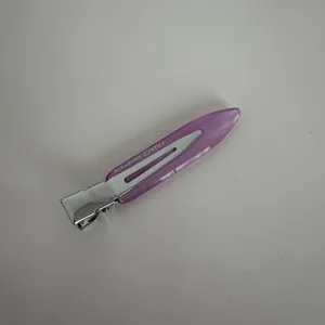 Close-up detail shot of the narrow acetate duckbill hair clip in light purple macaron color.