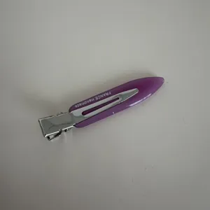 Detailed close-up shot of the purple acetate hair clip showing smooth texture and metal clip.