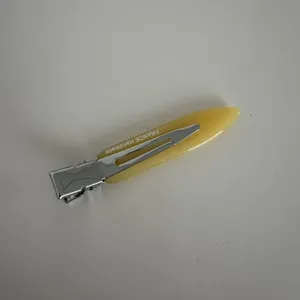 Detailed view of narrow acetate hair clip, minimalist fringe clip for daily styling and women.