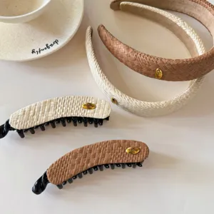 Exquisite straw weave hair band and banana clip set featuring gold tone metal tag details.