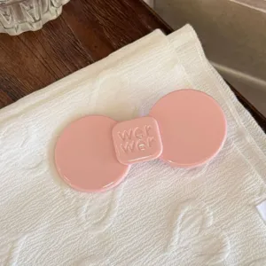 Pink acetate hair clip detail shot, elegant side hairpin for bangs and everyday chic styling.