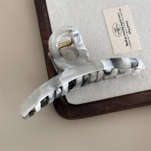 Elegant black and white marble hair claw clip vintage acetate large hair catch for women use.