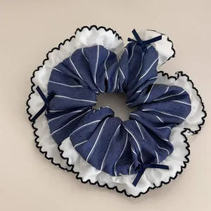 Navy blue stripe hair scrunchie with white lace ruffle edge and sweet bows detail close-up.
