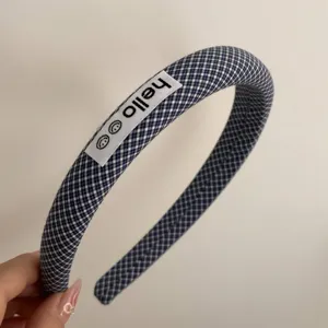 Navy blue plaid fabric hair hoop with cute hello label, stylish daily hair accessory.