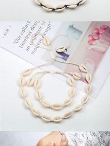 Ensemble collier et bracelet en coquillage cauri, bijoux de plage tissés bohèmes.