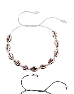Bohemian electroplated rose gold shell necklace detail with handmade braided cord and pearls.