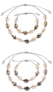 Set di gioielli con conchiglie intrecciate regolabili, bracciali e collane di conchiglie.