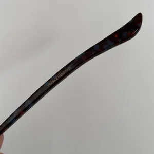 Acetate hairpin detail shot showing tortoise shell texture and handmade French craftsmanship.