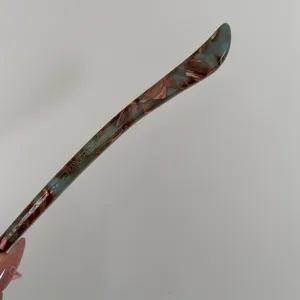 Elegant acetate hair stick with unique marbled pattern, minimalist hair accessory.