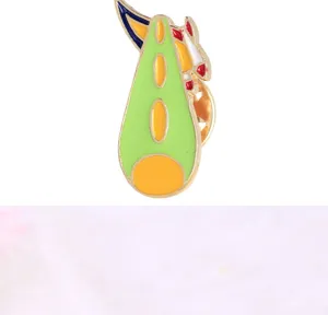 Alloy enamel rocket brooch detail, green cartoon spaceship badge pin for kids fashion.