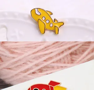 Cute cartoon airplane and rocket enamel pins, alloy fashion brooches for kids and daily wear details.