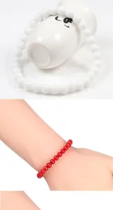 Detail view of 6mm turquoise beaded bracelet, smooth round beads, elegant wrist accessory.