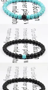 Set di bracciali con perline nero opaco e turchese, stile bohémien per coppie alla moda.