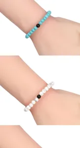 Set di bracciali di perle boho per coppie con turchese naturale e perle nere opache.