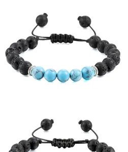 Verstelbare armband van zwarte lavasteen en turquoise kralen met zilveren tussenstukken.