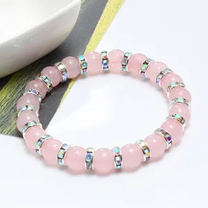 Elegante bracciale in pietra di quarzo rosa con splendidi distanziatori in strass.