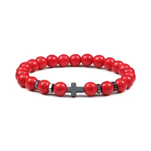 Rode steen kralenarmband met hematiet kruis en metalen tussenkralen voor yoga energie.