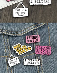 Creative enamel pin badge set featuring speech bubble and sign designs with cool text quotes.