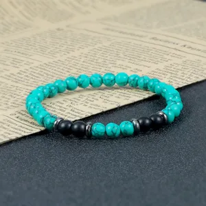 Turquoise stijl kralen yoga armband met zwarte matte kralen en metalen afstandshouders.