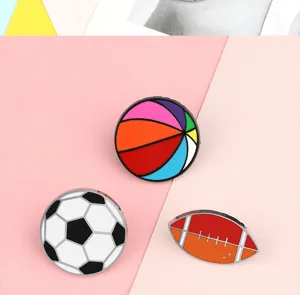 Alloy sports brooch set featuring basketball, soccer and rugby ball designs. Cute pins.