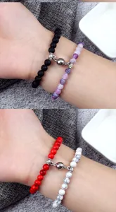 Detailed view of couple magnetic attraction bead bracelets featuring natural lava and stone beads.
