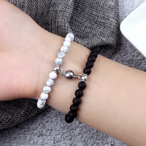 6mm magnetic couple bracelets set featuring black lava stone and white crackled beads with clasp.