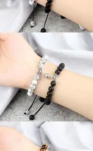 Couple magnetic attraction beaded bracelet set, matching black lava and white stone.