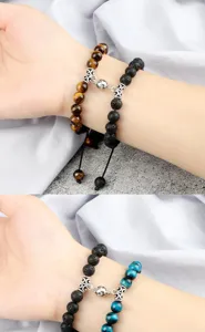 Detailed shot of handmade lava stone and tiger eye couple bracelets with magnetic clasps.