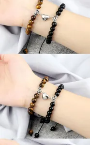 Matching couple magnetic heart bracelets with natural tiger eye and black onyx beads for gift.