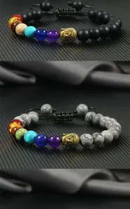 Details of chakra beaded bracelet with gold Buddha head and adjustable braided cord.