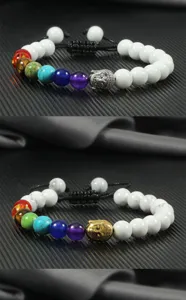 Detailed view of the 8mm white bead chakra bracelet with metal Buddha head and adjustable cord.