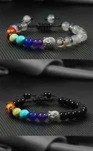 Detail view of couple braided beaded bracelet with silver Buddha head and 8mm round chakra stones.
