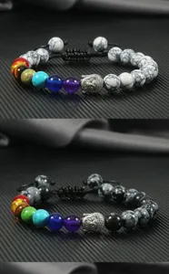 Chakra beaded bracelet detail showcasing silver alloy Buddha head charm and 8mm round natural stone beads.