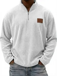 Men's vintage corduroy quarter zip pullover polo sweatshirt with chest patch detail.