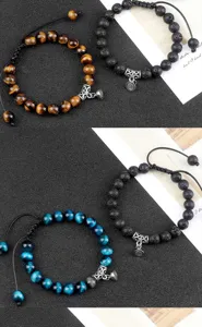 Close-up detail shot of handmade magnetic bead bracelets featuring tiger eye and lava stones.