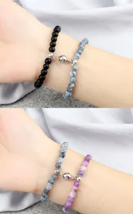 Close up detail of magnetic couple beaded bracelets showing the attractive clasp and stone texture.