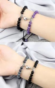Close-up detail of braided couple magnetic heart bracelets with matte and crackle beads.