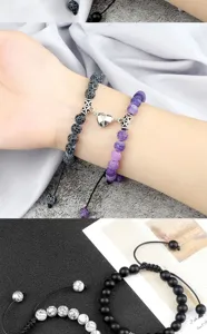 Detailed view of handmade couple magnetic matching bracelets with black and purple stone beads.