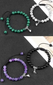 Handmade braided beaded couple bracelets with magnetic heart charms for lovers and best friends.