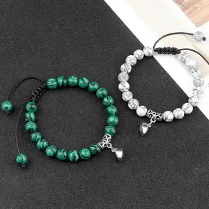 Magnetic couple matching beaded bracelets set with heart charms for lovers and best friends.