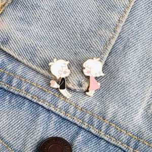 Cute cartoon boy and girl couple enamel brooch pin for denim jackets and bags decoration.