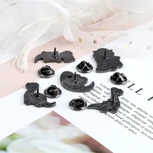 Cute cartoon dinosaur alloy brooches set, stylish black metal pins for backpacks and clothes.