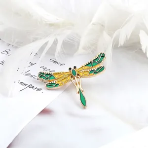 Exquisite dragonfly brooch with vibrant green and yellow enamel details for stylish outfits.