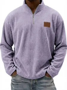 Close-up detail shot of mens corduroy quarter-zip mock neck pullover in light purple color.