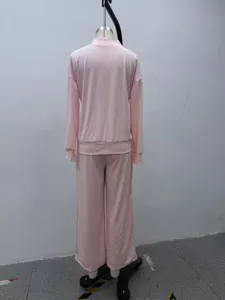 Pink solid stand collar zip hoodie and wide leg pants tracksuit detail back view.
