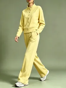 Detailed view of the solid color stand collar cardigan and wide leg casual pants set in yellow.