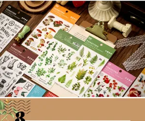 Detailed view of vintage plant and mushroom transfer stickers, perfect for DIY journaling crafts.