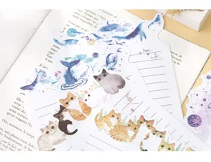 Papier à lettres mignon style aquarelle avec chats et baleines, design créatif pour écriture.
