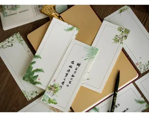 Set de papel de carta de estilo chino vintage con ilustraciones florales y caligrafía elegante.