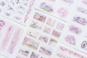 Closeup detail of cherry blossom watercolor stickers, perfect for journaling and art crafts.